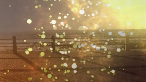 On start sea railing and walkway holding steady, bokeh orbs rising, sun flare 库存影片 335465294