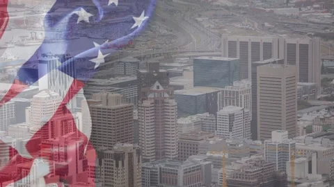 Start sheer US flag overlay appearing and rippling over city skyline creating Stock Footage 333477670