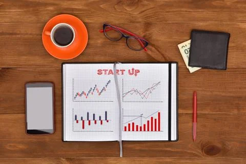 Start up statistics drawing in note pad Stock Photos