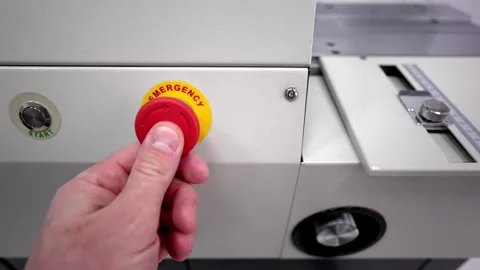 Start stop buttons. The man is pushing buttons. Start and stop. Stock Footage 303179067