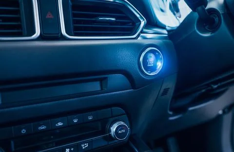 Start stop engine button of luxury car. Push up button for start or stop car  Stock-Fotos