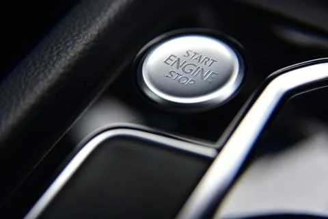 Start stop engine button on a modern car dashboard Stock Photos