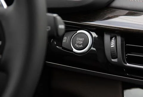 Start stop engine button on a modern car dashboard Stock Photos