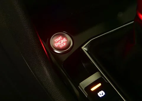 Start stop engine button on a modern car dashboard Stock Photos