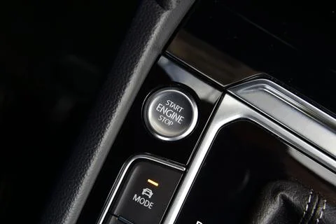 Start stop engine button on a modern car dashboard Stock Photos