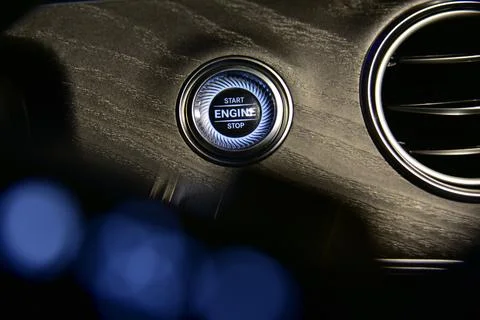 Start stop engine button on a modern car dashboard Stock Photos