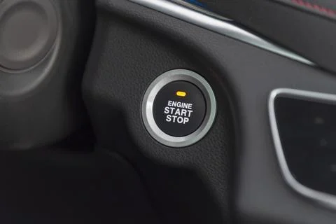 Start stop engine button on a modern car dashboard Stock Photos