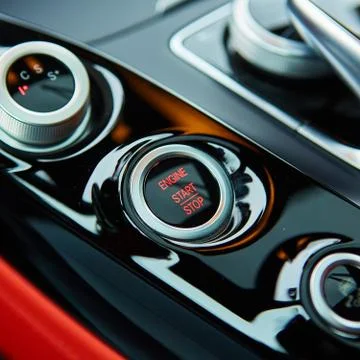 Start stop engine modern new car button Stock Photos