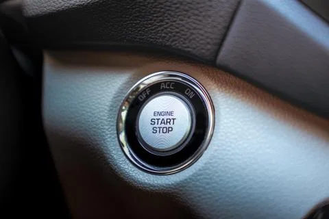 Start stop engine modern new technology car button, close up. Stock Photos