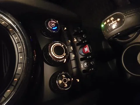 Start stop key into the lock of ignition of the car. Stock Photos