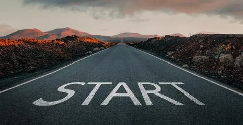 Start text on the empty endless road Stock Photos