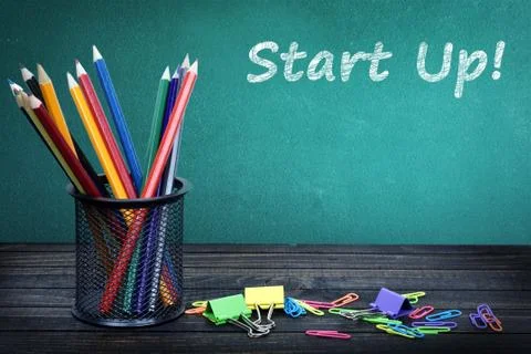 Start up text on green board Stock Photos