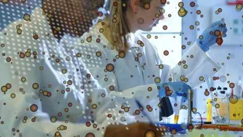 On start two lab techs pipetting and viewing vial, noting results, circular code Stock Footage 333733934