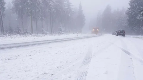 Start of winter. Snowplow on the road Видео 82787977