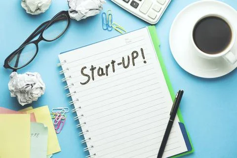 Start up word on notebook page Stock Photos