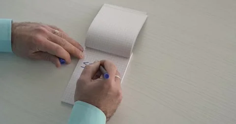 Start  - this word is written on the sheet by a man's hand Stock Footage 267082690
