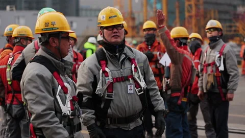 Before the start of the work shift are discussing a plan. Stock Footage 231220950
