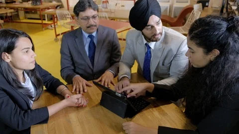 A start-up working and cracking jokes in a relaxed atmosphere as they joke is to Stock Footage 102082410