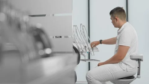 Before the start of the working day, the dentist prepares the office Stock Footage 269712865