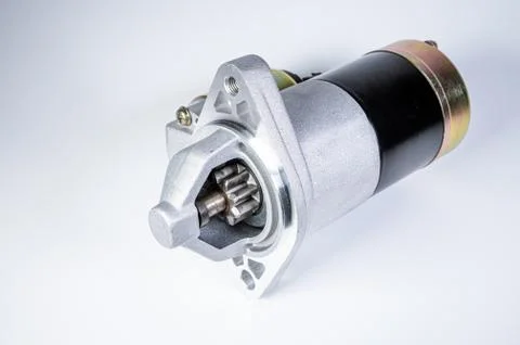 Starter of an internal combustion engine New Spare part for car on a gray Stock Photos