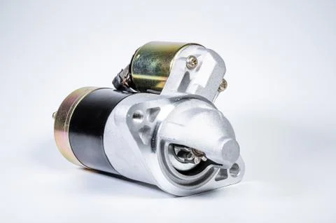 Starter of an internal combustion engine New Spare part for car on a gray 写真素材