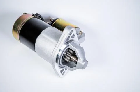 Starter of an internal combustion engine New Spare part for car on a gray 写真素材