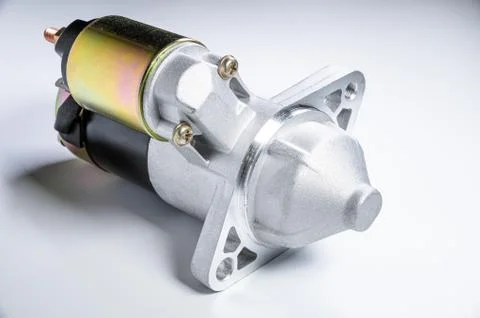 Starter of an internal combustion engine New Spare part for car on a gray 写真素材