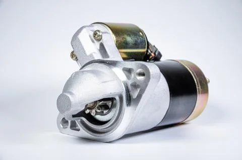 Starter of an internal combustion engine New Spare part for car on a gray 写真素材