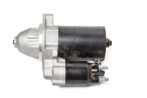 Starter of an internal combustion engine New Spare part for car on a white ba 스톡 사진