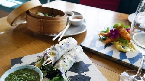 Starter of vegetable springrolls with dip - tilt-down shot Stock Footage 118046120