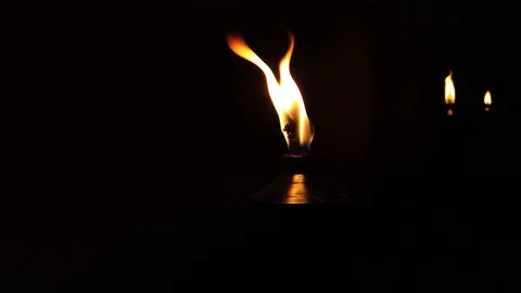 Starting with 3 torches inside, then Camera moves around 1 torch making the Stock Footage 120040977