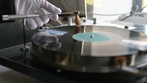 Starting and cleaning a record on a high-end vintage turntable Stock Footage 263543115