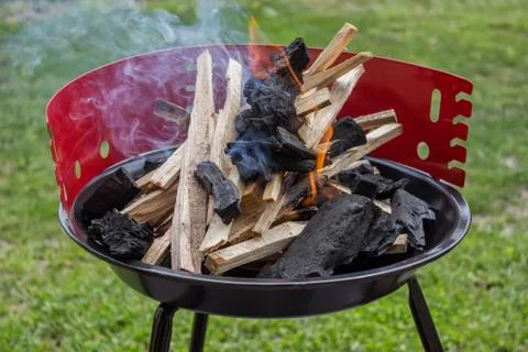 Starting up barbecue fire Stock Photos