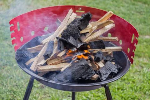 Starting up barbecue fire Stock Photos