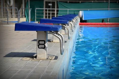 Starting blocks at swimming pool Stock Photos