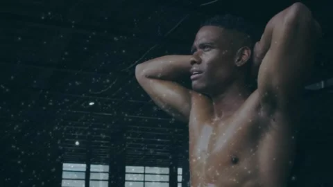 Starting breathing man hands-up shifting lifting in gym windows dust-drifting Stock Footage 323455118