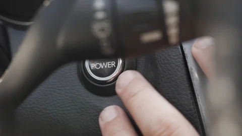 Starting car engine. Finger press the button to start the car engine. Stock Footage 106718116