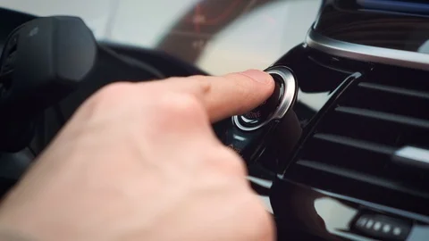 Starting car engine. Finger press the button to start the car engine. Stock Footage 125262684