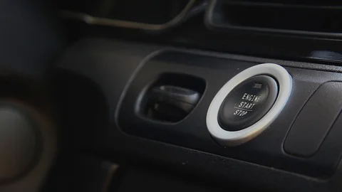 Starting car engine. Finger press the button to start the car engine Stock Footage 129175904