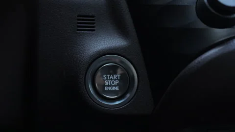 Starting car engine. Finger press the button to start the car engine. Track in Stock Footage 266723492