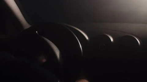 Starting car engine. Man preparing to drive at night. Stock Footage 145908615