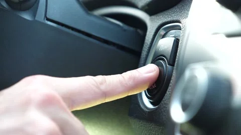 Starting car engine. Track in to the button. Finger press the button to start Stock Footage 133161144