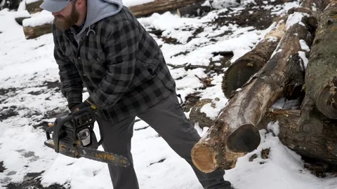 Starting a chainsaw in winter Stock Footage 141349682