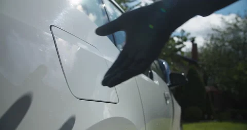 Starting to Charge electric car while wearing medical gloves Stock Footage 131655084