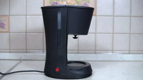 Starting the coffee machine to prepare coffee Stock Footage 139159776