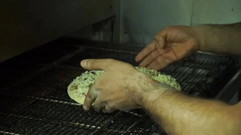 Starting to cook the pizza Stock Footage 187152450