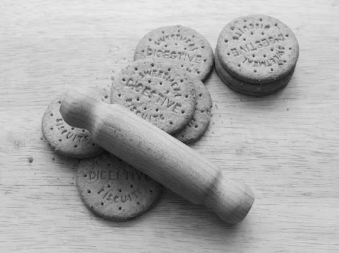 Starting to crush digestive biscuits with a rolling pin Stock Photos