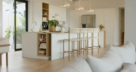 Starting on cushions, camera's pulling back to reveal island and sliding door, Stock Footage 337294108