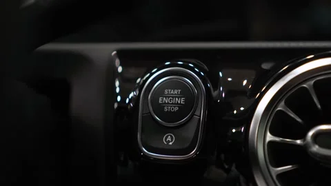 Starting the engine of a car with button. Stock Footage 144121723