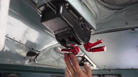Starting engine in helicopter. Fingers of hand turn on red switch. MI-8 Stock Footage 209326933